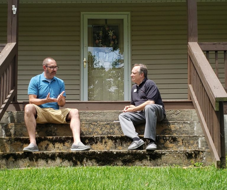 Two men discussing the vision for Solid Rock Children’s Ranch