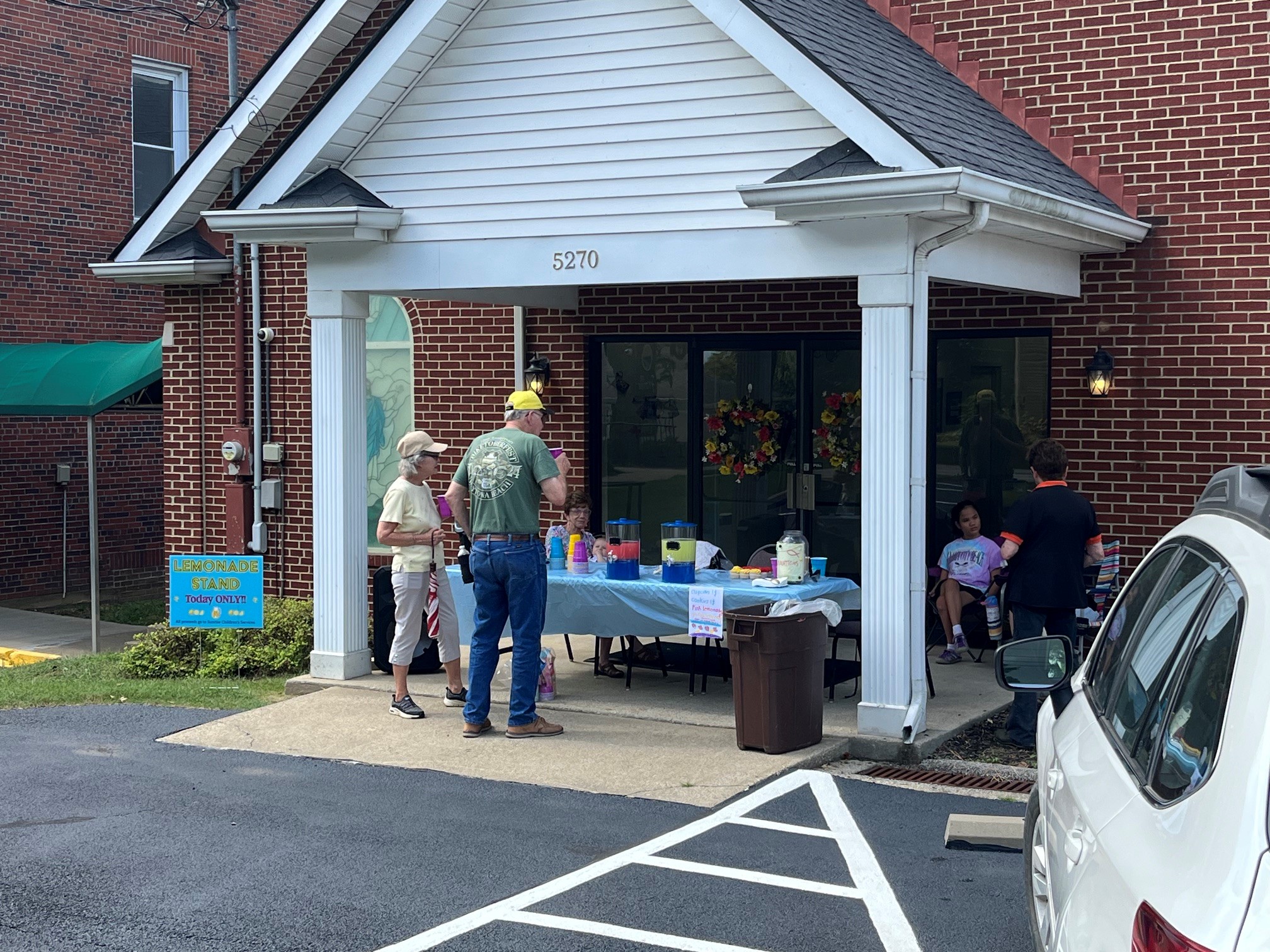 Elliana’s lemonade stand serving customers