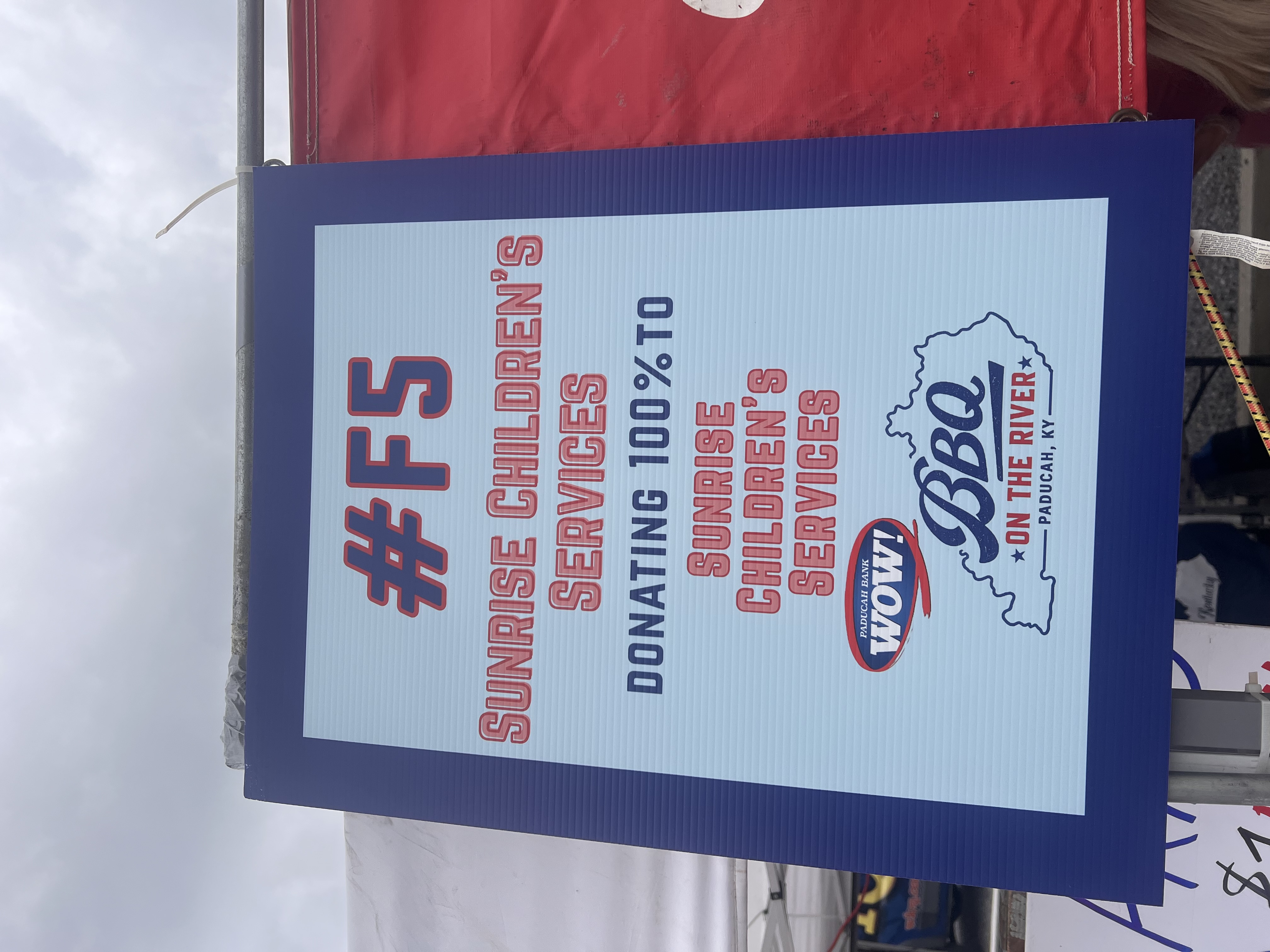 BBQ on the River event sign promoting Sunrise